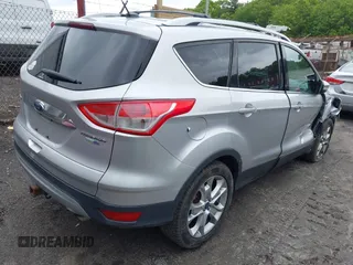 2015 Ford Escape Titanium z VIN 1FMCU9J91FUA85771, wystawiony jako IAAI lot #42306986 z przebiegiem 135 787 mil mil oraz . Historia ofert i sprzedaży dostępna na DreamBid. Obrazek 4.