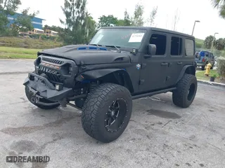 2018 Jeep Wrangler Unlimited Sport S with VIN 1C4HJXDG2JW228483, listed as a IAAI auction lot 41710364 with 56,970 mi miles. Bid and sale history available at carsss.com. Image 18.