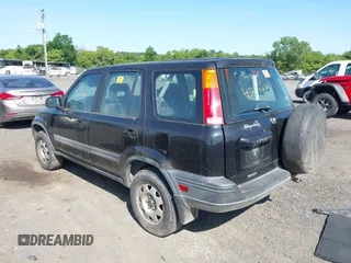 1999 Honda CR-V LX z VIN JHLRD2842XC010409, wystawiony jako IAAI lot #42402281 z przebiegiem 265 901 mil mil oraz . Historia ofert i sprzedaży dostępna na DreamBid. Obrazek 3.