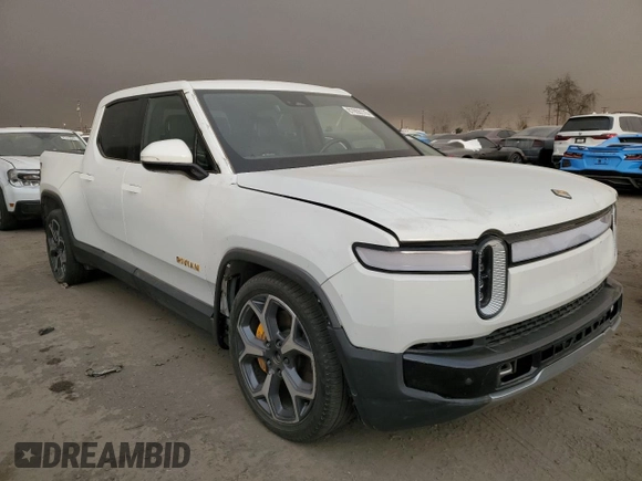 2022 Rivian R1T Adventure z VIN 7FCTGAAA9NN014280, wystawiony jako Copart lot #87908175 z przebiegiem 28 601 mil mil oraz Szkody całkowita. Historia ofert i sprzedaży dostępna na DreamBid. Obrazek 4.