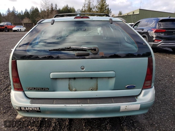 1994 Ford Taurus with VIN 1FALP5747RG236623, listed as a Copart auction lot 85242504 with 205,550 mi miles and Salvage title. Bid and sale history available at DreamBid. Image 6.
