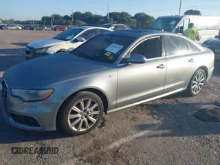 2013 Audi A6 3.0T Prestige with VIN WAUJGAFC6DN131821, listed as a IAAI auction lot 41411463 with 186,380 mi miles. Bid and sale history available at carsss.com. Image 2.