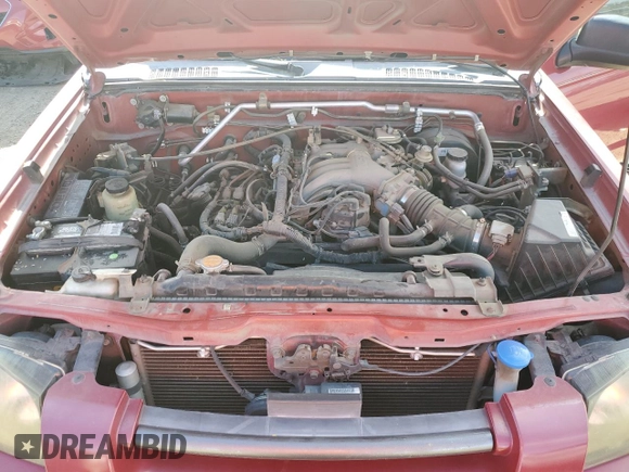 2003 Nissan Frontier XE with VIN 1N6ED27T13C409632, listed as a Copart auction lot 84884434 with 194,167 mi miles and Salvage title. Bid and sale history available at DreamBid. Image 12.