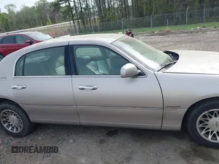 2001 Lincoln Town Car Signature with VIN 1LNHM82W21Y684197, listed as a IAAI auction lot 41944429 with 159,297 mi miles and . Bid and sale history available at DreamBid. Image 13.