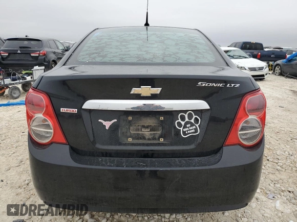 2012 Chevrolet Sonic LTZ z VIN 1G1JE5SB2C4173638, wystawiony jako Copart lot #84634474 z przebiegiem 148 247 mil mil oraz Szkoda całkowita • Salvage title. Historia ofert i sprzedaży dostępna na DreamBid. Obrazek 6.