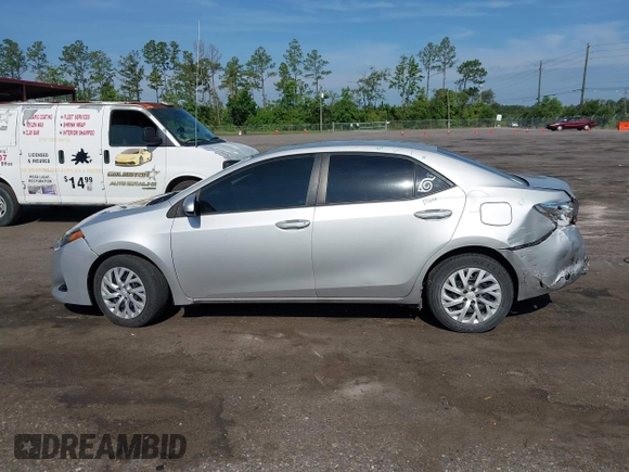 2018 Toyota Corolla L with VIN 5YFBURHEXJP810003, listed as a IAAI auction lot 42526648 with 84,546 mi miles and . Bid and sale history available at DreamBid. Image 15.