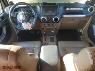 2011 Jeep Wrangler Unlimited Sahara with VIN 1J4BA5H10BL558961, listed as a Copart auction lot 74806494 with 172,855 mi miles and Salvage Title. Bid and sale history available at carsss.com. Image 8.