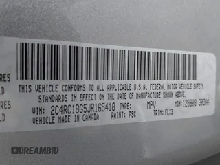 2018 Chrysler Pacifica Touring L with VIN 2C4RC1BG5JR165418, listed as a IAAI auction lot 42143241 with 157,768 mi miles and . Bid and sale history available at DreamBid. Image 9.