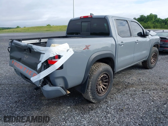 2022 Nissan Frontier SV z VIN 1N6ED1EJ0NN629038, wystawiony jako IAAI lot #41313351 z przebiegiem 98 234 mil mil oraz . Historia ofert i sprzedaży dostępna na DreamBid. Obrazek 4.