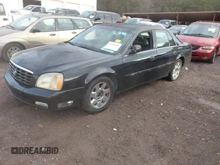 2002 Cadillac DeVille DTS with VIN 1G6KF57992U219921, listed as a IAAI auction lot 41261360 with 127,710 mi miles. Bid and sale history available at carsss.com. Image 2.