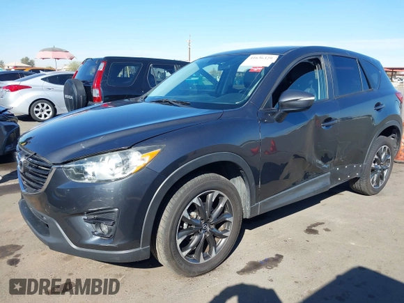 2016 Mazda CX-5 Grand Touring z VIN JM3KE2DYXG0649781, wystawiony jako IAAI lot #41636329 z przebiegiem 83 433 mil mil oraz . Historia ofert i sprzedaży dostępna na DreamBid. Obrazek 17.