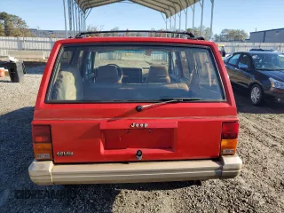1993 Jeep Cherokee z VIN 1J4FT78S9PL634409, wystawiony jako Copart lot #77034984 z przebiegiem 146 585 mil mil oraz Szkoda całkowita • Salvage title. Historia ofert i sprzedaży dostępna na DreamBid. Obrazek 6.