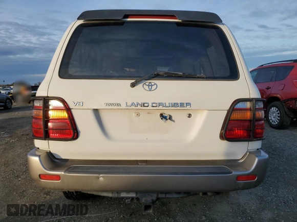 2000 Toyota Land Cruiser z VIN JT3HT05J0Y0122711, wystawiony jako Copart lot #86929954 z przebiegiem Nie podano mil oraz Czysty tytuł • Clean title. Historia ofert i sprzedaży dostępna na DreamBid. Obrazek 6.