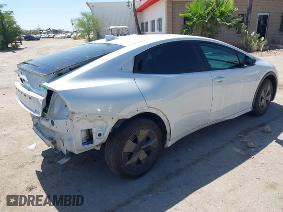 2024 Toyota Prius LE with VIN JTDACAAU5R3046244, listed as a IAAI auction lot 42464523 with 13,590 mi miles and . Bid and sale history available at DreamBid. Image 4.