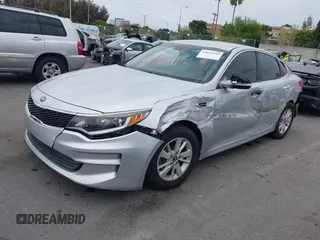 2016 Kia Optima LX with VIN 5XXGT4L34GG023812, listed as a IAAI auction lot 42034160 with 96,720 mi miles and . Bid and sale history available at DreamBid. Image 2.