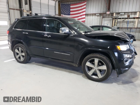 2015 Jeep Grand Cherokee Overland with VIN 1C4RJFCG0FC783375, listed as a Copart auction lot 61966725 with 191,478 mi miles and Salvage title. Bid and sale history available at DreamBid. Image 4.