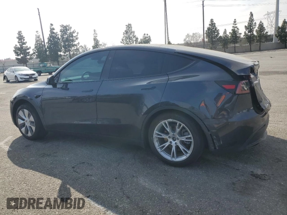 2024 Tesla Model Y Long Range with VIN 7SAYGDEE2RA244242, listed as a Copart auction lot 52635095 with 4,994 mi miles and Salvage title. Bid and sale history available at DreamBid. Image 2.