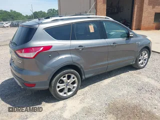 2014 Ford Escape Titanium z VIN 1FMCU0JX3EUA26519, wystawiony jako IAAI lot #42553081 z przebiegiem 108 052 mil mil oraz . Historia ofert i sprzedaży dostępna na DreamBid. Obrazek 4.