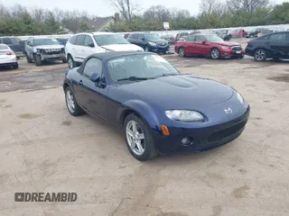 2007 Mazda MX-5 Miata Sport z VIN JM1NC25F170128330, wystawiony jako IAAI lot #41824608 z przebiegiem 125 381 mil mil oraz . Historia ofert i sprzedaży dostępna na DreamBid. Obrazek 1.