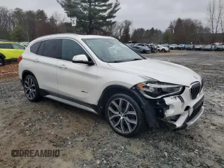 2017 BMW X1 xDrive28i with VIN WBXHT3C38H5F70088, listed as a Copart auction lot 50447715 with 119,649 mi miles and Clean Title. Bid and sale history available at carsss.com. Image 4.