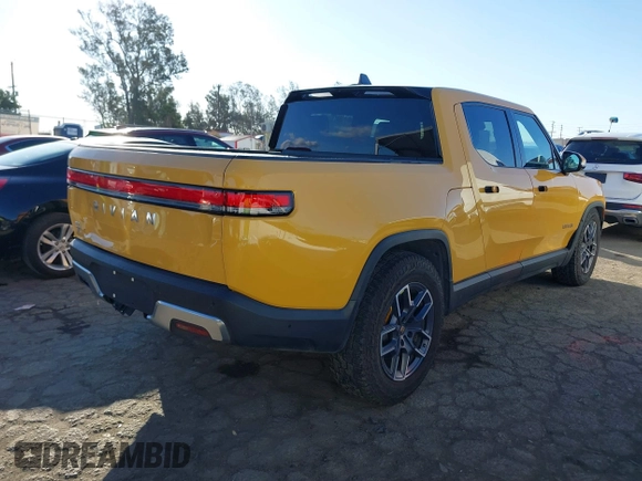 2022 Rivian R1T Adventure Package with VIN 7FCTGAAA2NN005811, listed as a IAAI auction lot 41706558 with 21,336 mi miles. Bid and sale history available at carsss.com. Image 4.