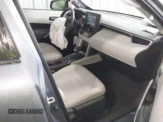 2022 Toyota Corolla Cross L with VIN 7MUAAAAG9NV034659, listed as a IAAI auction lot 42125356 with 14,631 mi miles and . Bid and sale history available at DreamBid. Image 5.