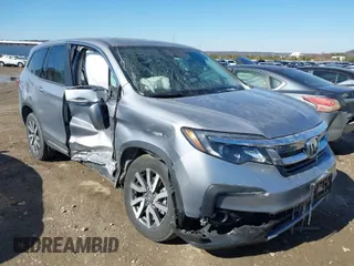 2022 Honda Pilot EX-L with VIN 5FNYF6H54NB018613, listed as a IAAI auction lot 41566973 with 56,173 mi miles. Bid and sale history available at carsss.com. Image 1.