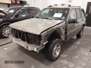 1997 Jeep Grand Cherokee Laredo with VIN 1J4GZ58S2VC746778, listed as a IAAI auction lot 41225925 with 196,679 mi miles. Bid and sale history available at carsss.com. Image 6.