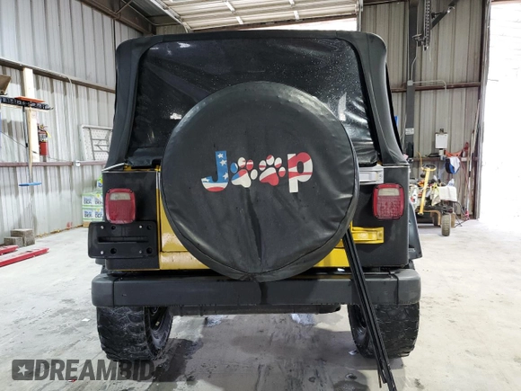 2002 Jeep Wrangler Sport z VIN 1J4FA49S02P730417, wystawiony jako Copart lot #59620865 z przebiegiem Nie podano mil oraz Szkoda całkowita • Salvage title. Historia ofert i sprzedaży dostępna na DreamBid. Obrazek 6.