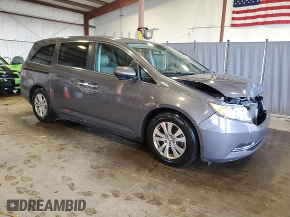 2014 Honda Odyssey EX-L with VIN 5FNRL5H6XEB134849, listed as a Copart auction lot 63617435 with 127,491 mi miles and Salvage title. Bid and sale history available at DreamBid. Image 4.