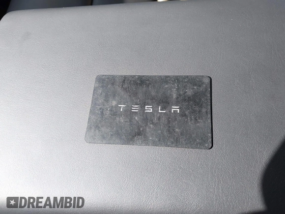 2023 Tesla Model Y Long Range with VIN 7SAYGDEE7PF832007, listed as a IAAI auction lot 41751598 with 14,126 mi miles and . Bid and sale history available at DreamBid. Image 11.