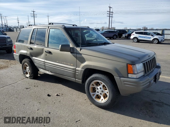 1997 Jeep Grand Cherokee Limited with VIN 1J4GZ78Y4VC754624, listed as a Copart auction lot 49884435 with 144,682 mi miles and Salvage Title. Bid and sale history available at carsss.com. Image 4.