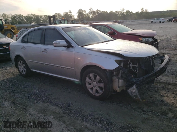 2009 Kia Optima LX z VIN KNAGE228195332931, wystawiony jako Copart lot #55279665 z przebiegiem 295 523 mil mil oraz Szkoda całkowita • Salvage title. Historia ofert i sprzedaży dostępna na DreamBid. Obrazek 4.