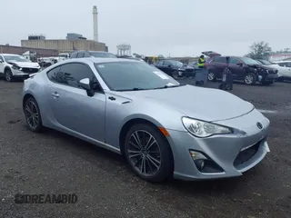 2015 Scion FR-S z VIN JF1ZNAA10F9704134, wystawiony jako IAAI lot #42535921 z przebiegiem 130 242 mil mil oraz . Historia ofert i sprzedaży dostępna na DreamBid. Obrazek 1.