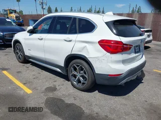 2017 BMW X1 xDrive28i with VIN WBXHT3C33H5F86831, listed as a IAAI auction lot 42019082 with 74,708 mi miles and . Bid and sale history available at DreamBid. Image 3.