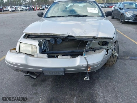 2004 Ford Crown Victoria Standard with VIN 2FAFP73W94X107561, listed as a IAAI auction lot 41804985 with 128,066 mi miles. Bid and sale history available at carsss.com. Image 6.