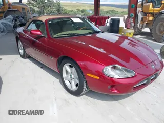 1997 Jaguar XK with VIN SAJGX274XVC004952, listed as a IAAI auction lot 42211023 with 109,889 mi miles and . Bid and sale history available at DreamBid. Image 1.