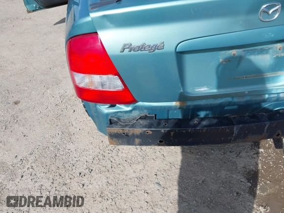 2002 Mazda Protege DX z VIN JM1BJ225721591435, wystawiony jako IAAI lot #42117544 z przebiegiem 191 185 mil mil oraz . Historia ofert i sprzedaży dostępna na DreamBid. Obrazek 14.