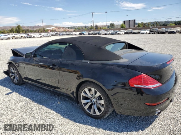 2009 BMW 6 Series 650i with VIN WBAEB53569C224337, listed as a Copart auction lot 68148974 with 75,057 mi miles and Salvage Title. Bid and sale history available at carsss.com. Image 2.