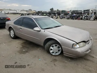 1994 Ford Thunderbird LX with VIN 1FALP6241RH110457, listed as a Copart auction lot 76384254 with 54,653 mi miles and Salvage Title. Bid and sale history available at DreamBid. Image 4.