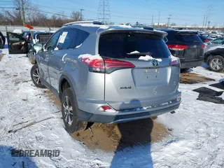 2018 Toyota RAV4 XLE with VIN 2T3RFREV8JW753853, listed as a IAAI auction lot 41526071 with 104,642 mi miles. Bid and sale history available at carsss.com. Image 3.
