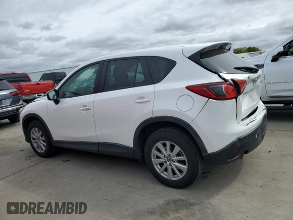 2016 Mazda CX-5 Touring with VIN JM3KE2CYXG0777715, listed as a Copart auction lot 52157005 with 58,585 mi miles and Salvage Title. Bid and sale history available at carsss.com. Image 2.