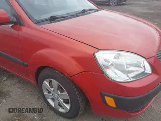 2009 Kia Rio SX with VIN KNADE223996556806, listed as a IAAI auction lot 42117938 with 54,007 mi miles. Bid and sale history available at carsss.com. Image 6.