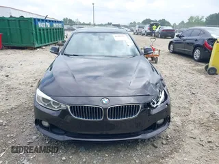 2014 BMW 4 Series 435i with VIN WBA3T3C50EJ876997, listed as a IAAI auction lot 42406299 with 115,048 mi miles and . Bid and sale history available at DreamBid. Image 12.