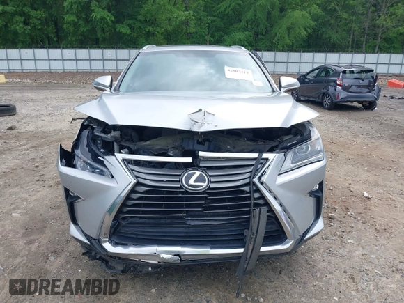 2016 Lexus RX 350 z VIN 2T2ZZMCA5GC002315, wystawiony jako IAAI lot #42107312 z przebiegiem 156 339 mil mil oraz . Historia ofert i sprzedaży dostępna na DreamBid. Obrazek 13.