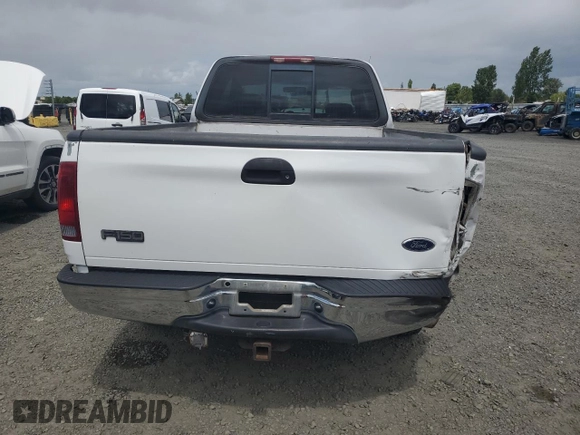 2002 Ford F-150 XL with VIN 1FTRX18L62KC53807, listed as a Copart auction lot 57463075 with 173,301 mi miles and Salvage title. Bid and sale history available at DreamBid. Image 6.