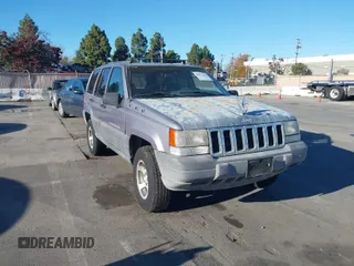1996 Jeep Grand Cherokee Laredo with VIN 1J4FX58S8TC169575, listed as a IAAI auction lot 40971134 with 152,116 mi miles. Bid and sale history available at carsss.com. Image 1.
