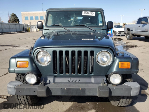 2003 Jeep Wrangler Sahara z VIN 1J4FA59SX3P302622, wystawiony jako Copart lot #52756105 z przebiegiem 181 900 mil mil oraz Szkoda całkowita • Salvage title. Historia ofert i sprzedaży dostępna na DreamBid. Obrazek 5.