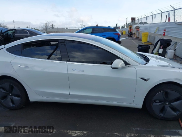 2018 Tesla Model 3 Long Range Battery with VIN 5YJ3E1EA3JF023300, listed as a IAAI auction lot 41925504 with 100,512 mi miles and . Bid and sale history available at DreamBid. Image 14.