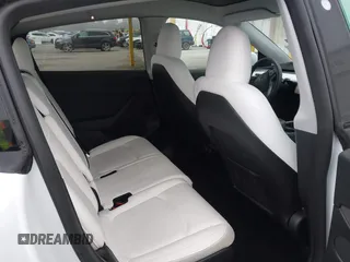 2023 Tesla Model Y Long Range with VIN 7SAYGAEE7PF766735, listed as a IAAI auction lot 41626651 with 21,983 mi miles. Bid and sale history available at carsss.com. Image 8.